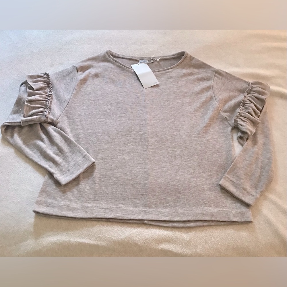 Women’s Medium size, Long sleeves, ruffles at mid-arm, light Brown color